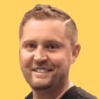 David Dember, Team Lead - Enterprise Sales Development at Sendoso headshot on yellow background